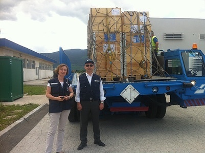 WHO staff supervising the arrival of water purification kits to deliver communities in Bosnia and Herzegovina, Croatia and Serbia, which were severely affected by floods in May 2014.