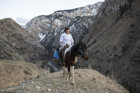 Jiydekul Yrysbayeva (54) rides a horse to reach her neighbours with vaccination and other health services in an inaccessible mountainous region in the Karatal Japyryk area, 4000 meters above sea level, Naryn region, Kyrgyzstan. In the remote, rugged landscapes of Naryn, Kyrgyzstan, where access to healthcare is often a journey unto itself, a dedicated figure stands tall amidst the challenges. Meet Jiydekul Yrysbayeva, a beacon of hope and resilience in a region where medical services are sparse and distances vast. In this documentary photo story, we delve into the life and work of Jiydekul Yrysbayeva, a feldsher who lives in Karatal Japyryk area of Naryn, the most mountainous region of Kyrgyzstan, 2500 meters above sea level, and embodies the spirit of service and compassion. Despite the logistical hurdles of reaching this inaccessible part of Kyrgyzstan, Jiydekul Yrysbayeva tirelessly dedicates herself to the well-being of her community. Part-time medical worker, part-time livestock farmer and full-time advocate for health, Jiydekul Yrysbayeva's mission extends beyond the confines of her medical station. With a particular focus on vaccination, she plays a crucial role in safeguarding the lives of her fellow Kyrgyzstanis. Through her efforts, she not only administers vaccines but also educates community about the importance of immunization. This documentary photo series sheds light on Kyrgyzstan's relentless efforts in the realm of vaccination and immunization with WHO's and other allies' support. Over 50 years, the Expanded Immunization Program has been a cornerstone of health protection in the WHO European Region, of which Kyrgyzstan is a part. 2024 also marks 30 years for Kyrgyzstan's National Immunization Program, being a massive part of public health initiatives, saving countless lives and fortifying generations against preventable diseases. As we commemorate European Immunization Week, join us in celebrating the unwavering commitment of Jiydekul Yrysbayeva and her peers. Through their dedication and the power of vaccines, they not only save lives but also lay the foundation for a healthier, resilient future for Kyrgyzstan and beyond. Partnering with the European Union A project co-funded by the European Union is currently being implemented in Kyrgyzstan and 4 other central Asian republics – Kazakhstan, Tajikistan, Turkmenistan, Uzbekistan. The project involves supporting the ministries of health with immunization and supply chain logistics, risk communication and community engagement, and the capacity-building of health-care professionals, paving the way to achieve the goals and targets of the European Immunization Agenda 2030.