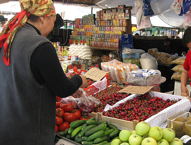 Customer at a fruit and vegetable stand in Kyrgyzstan.