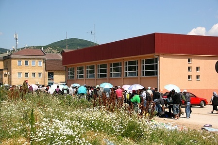 Migrants queue to to register as asylum seekers in Serbia.

Most migrants arriving to Serbia stay in the country for a limited time on their way to the European Union. After registering, they have three days to enter an asylum center. However, none of the asylum centers have reached full capacity and most migrants continue their journey.