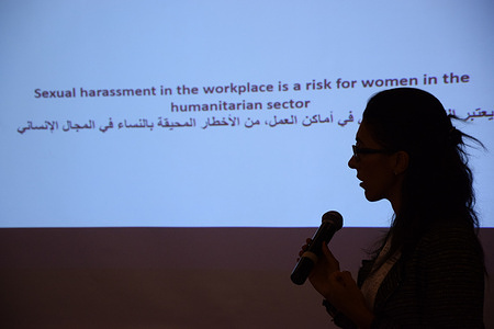 Silhouetted speaker presenting a gender equality training session in Gazientep.