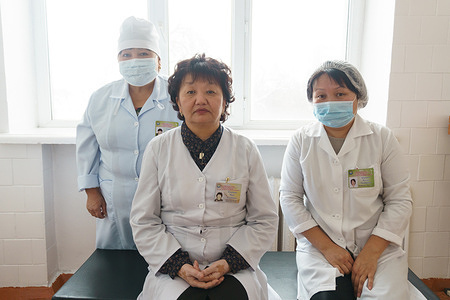 Three female health professionals in a hospital setting. 

In November 2017, the Ministry of Health of Kyrgyzstan together with WHO Country Office organized a national month-long campaign to promote seasonal influenza vaccination among the people most vulnerable to the disease. 

Mira, Gulsara and Kanymgyl have been working at the Family Medical Centre for many years, and like hundreds of other vaccinators in Kyrgyzstan, they were trained in 2017 to deliver the seasonal influenza vaccine effectively and safely. The trainings, which took place throughout the country, included guidance for storing and administering the multi-dose vaccine vials. Health-care workers believe that being trained on administering multi-dose influenza vaccine is essential for them, because Kyrgyzstan has not worked with this type of vaccine before.