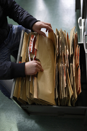 Patient medical records in a filing cabinet.